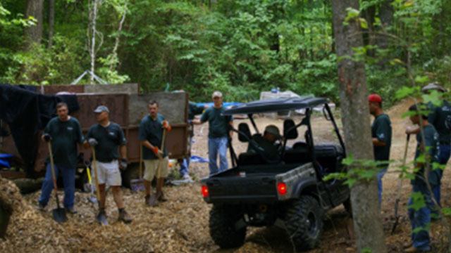 truck in woods around convergint workers header image