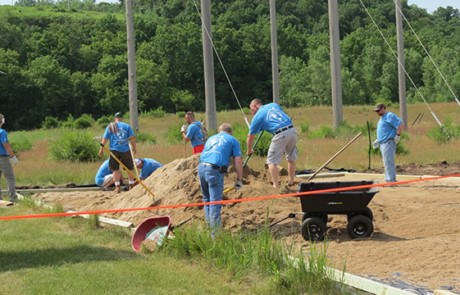 Convergint day Minnesota colleagues working in the sand
