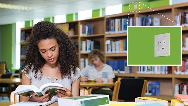 girl studying in college library with guardian security