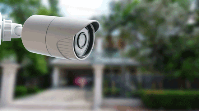 Video surveillance camera on wall