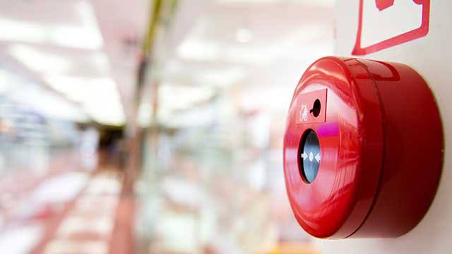 Fire alarm on the wall of shopping center header image