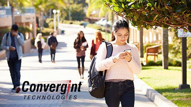 Students Walking Outdoors On University Campus