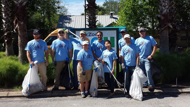 Convergint day Jacksonville colleagues picking up waste at a zoo header image