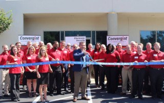 Atlanta Grand Opening Group Image Cutting the Ribbon