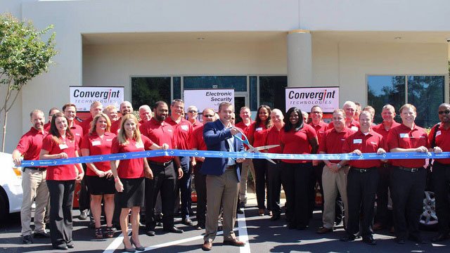 Atlanta Grand Opening Group Image Cutting the Ribbon