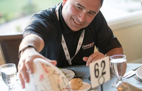 Male Colleague Holding a Football Image