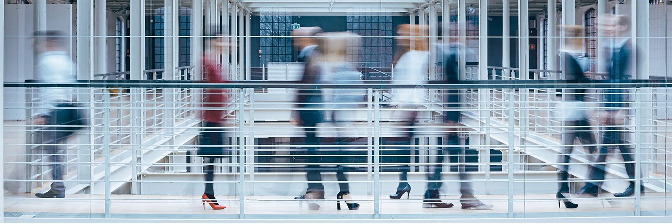 Lenel-Header-Image People walking in a building