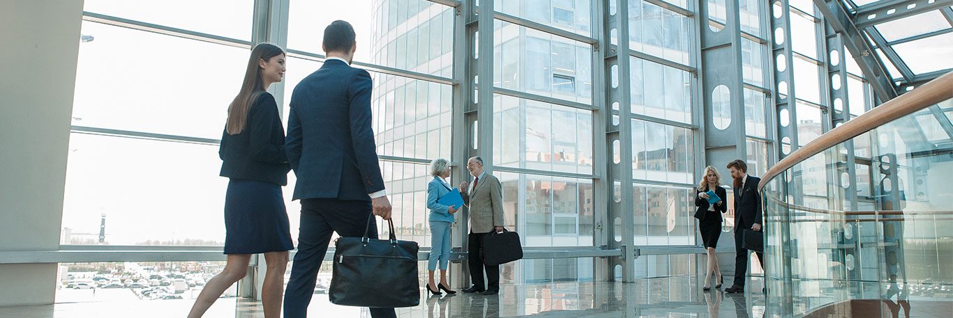 Software-House-Header-AdWords People walking through a building