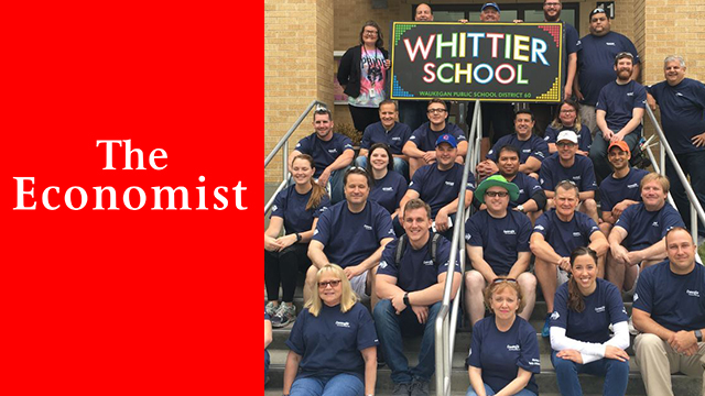 Convergint Colleagues Sit on the Steps of a School At Which They Volunteered