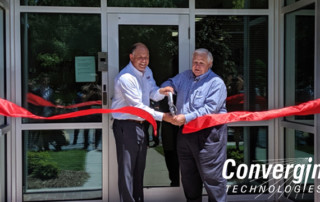 Convergint colleague and mayor cutting ribbon