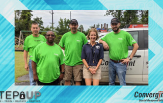 Convergint colleagues standing with school principal