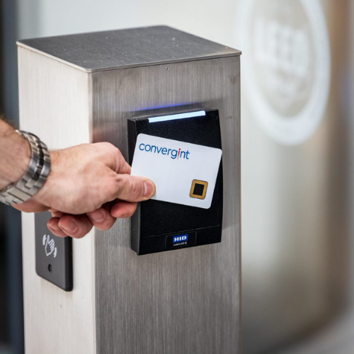 a person using a badge to access a building