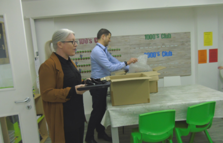 Convergint colleagues and school principal in a class room