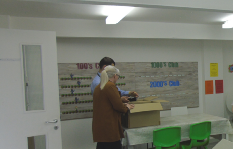 Convergint colleagues and school principal in a class room