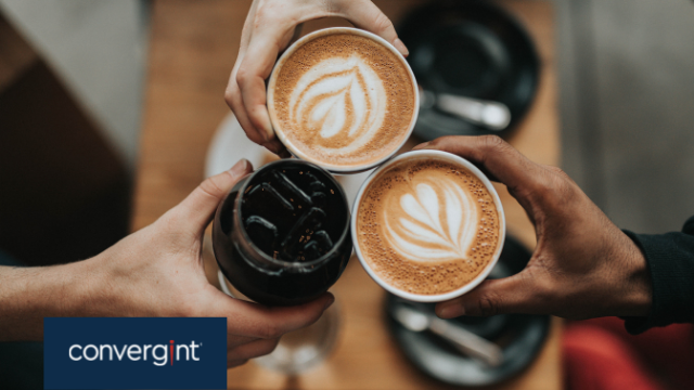 Three individuals holding cups of coffee