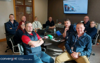 colleagues gathered around a table at a meeting