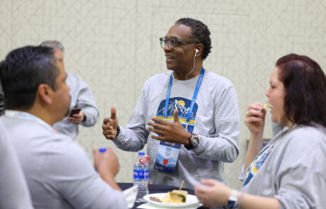 A group of people eating and talking