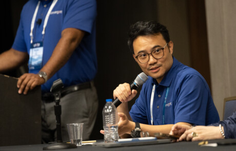 Man speaking into a microphone 