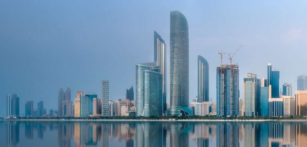 Abu Dhabi skyline with modern skyscrapers along the waterfront.