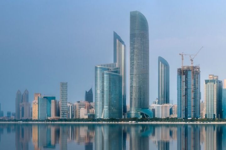 Abu Dhabi skyline with modern skyscrapers along the waterfront.