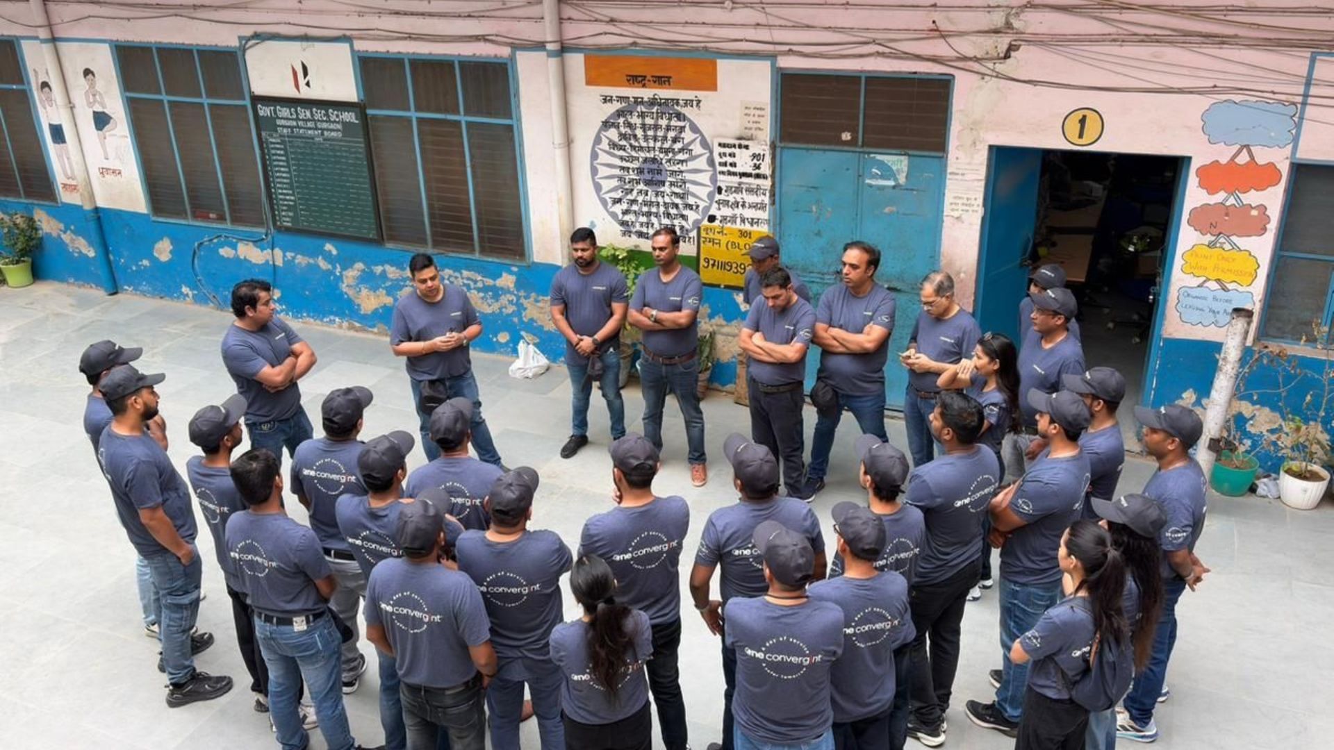 A group of colleagues huddled for a meeting