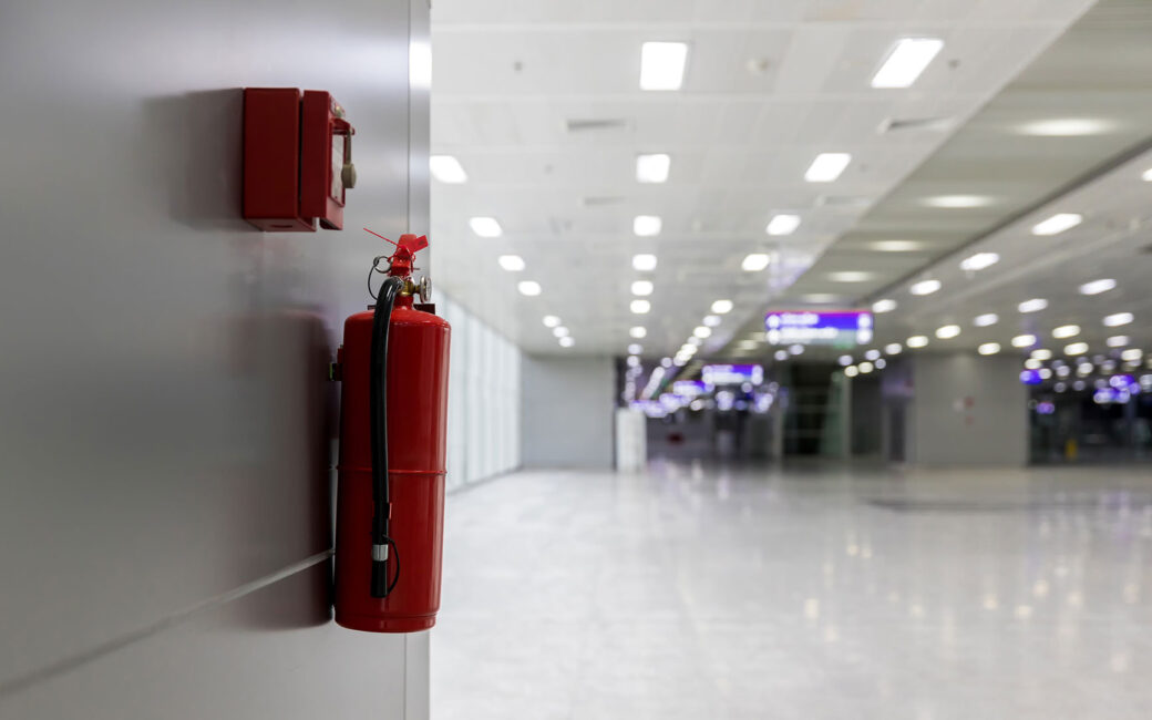 Dry chemical powder fire extinguisher in corridor